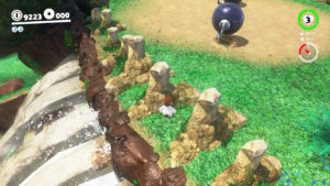 Mario above waterfall near giant bones